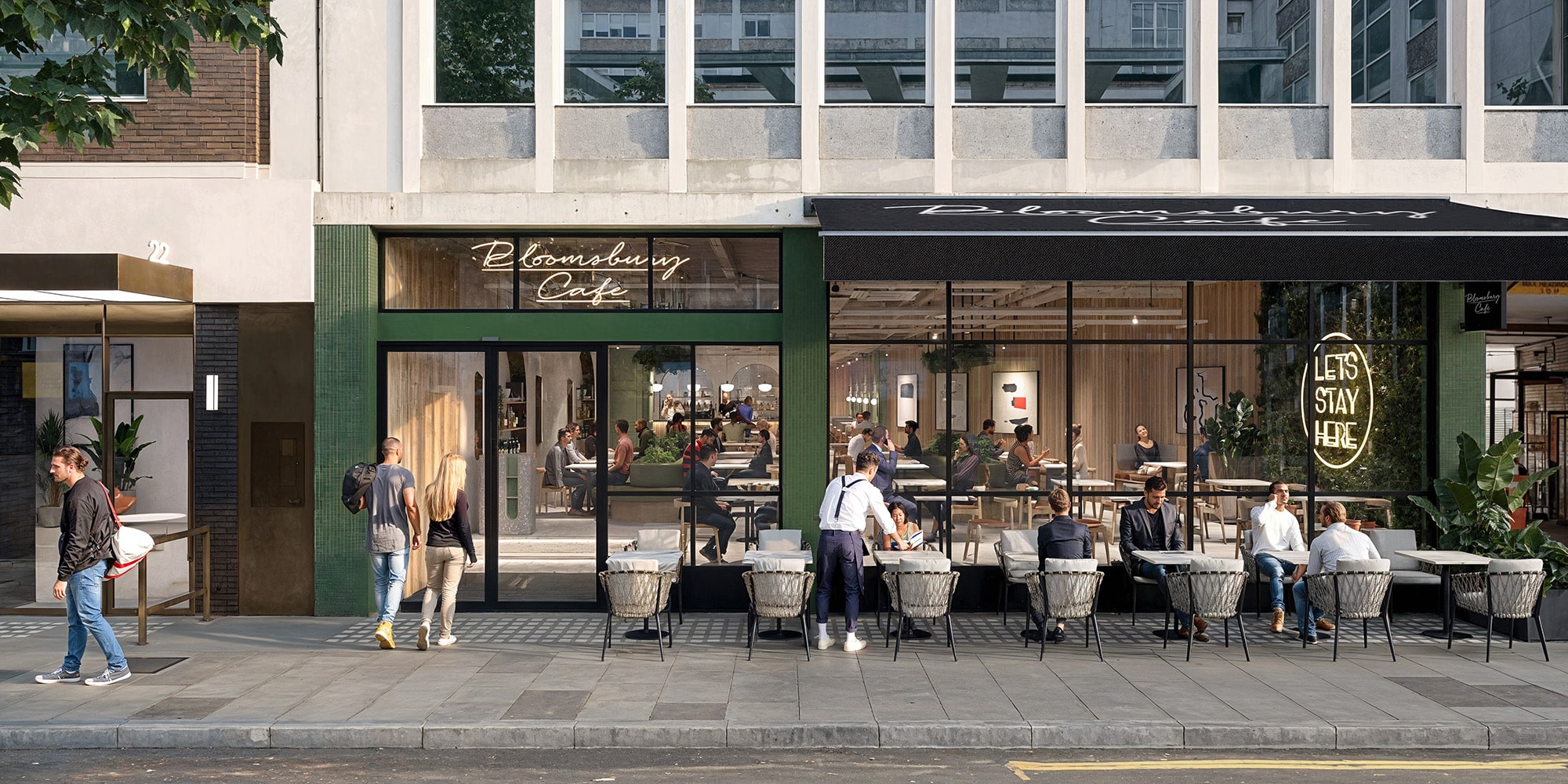 Street view of a modern cafe with outdoor seating and people walking by.